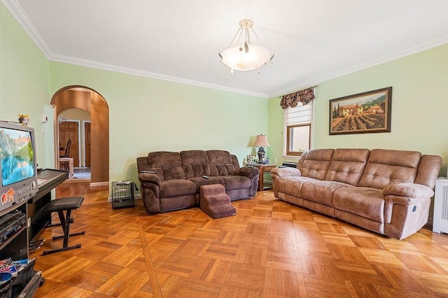 living area with arched walkways and ornamental molding