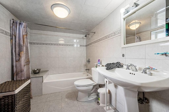 full bath featuring tile walls, tasteful backsplash, toilet, shower / bath combo, and tile patterned flooring