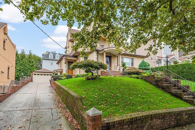 view of front of property with a garage, a residential view, a front lawn, and stucco siding