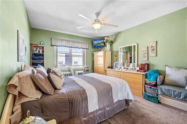 bedroom with ceiling fan and carpet floors