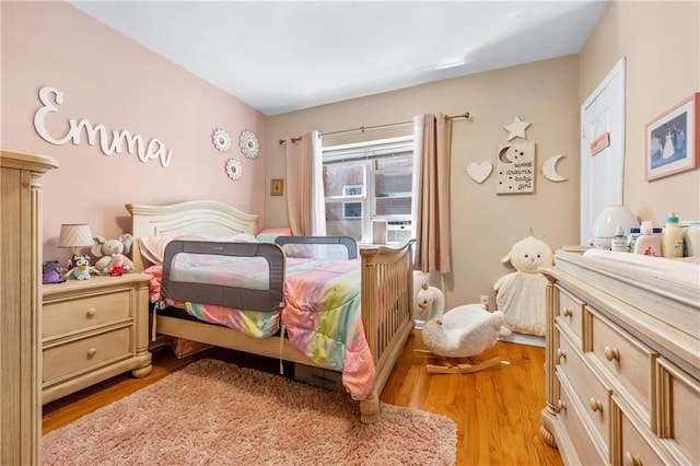 bedroom with light wood-style floors