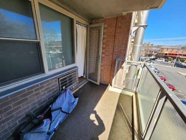 balcony with a wall mounted AC