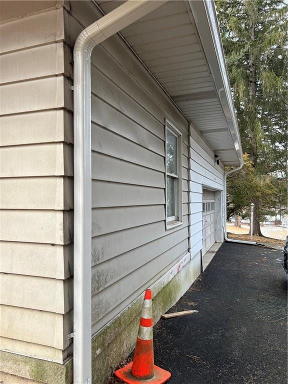 view of side of property with a garage