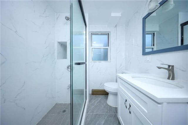 full bath featuring tile walls, toilet, a shower stall, and vanity