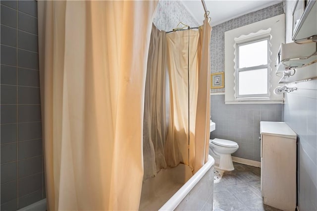 bathroom featuring shower / bath combination with curtain and toilet