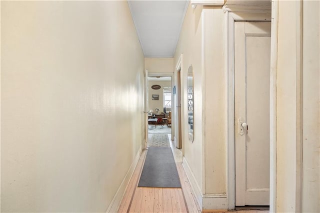 hall with light hardwood / wood-style floors