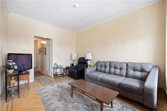 living room with wood-type flooring and crown molding