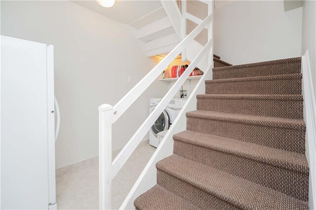 staircase with washer / clothes dryer