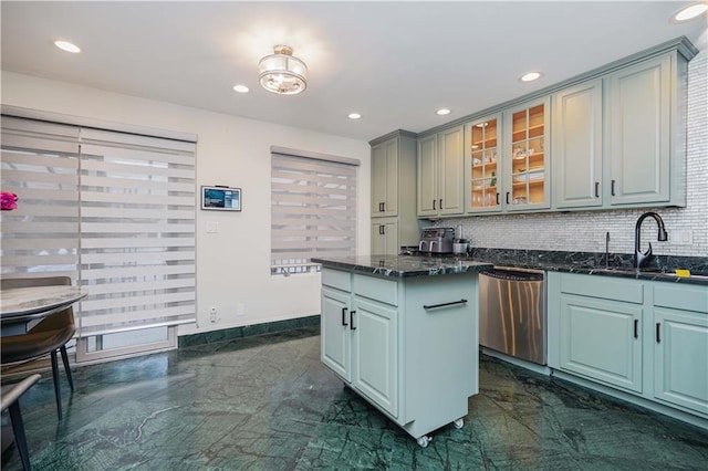 kitchen with a sink, glass insert cabinets, dishwasher, marble finish floor, and backsplash