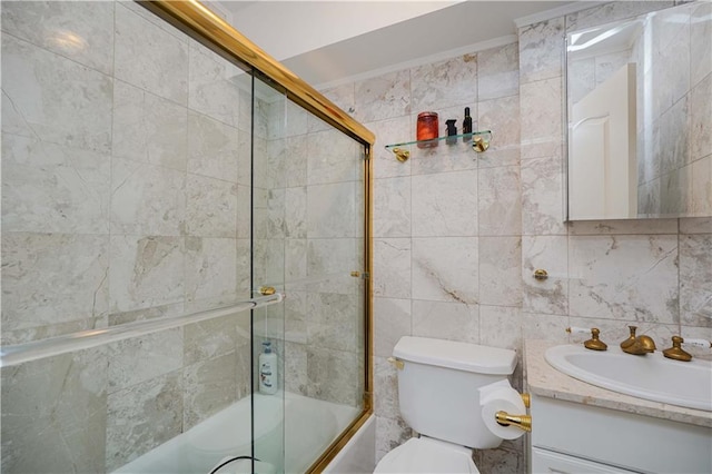 full bathroom featuring vanity, tasteful backsplash, tile walls, toilet, and combined bath / shower with glass door