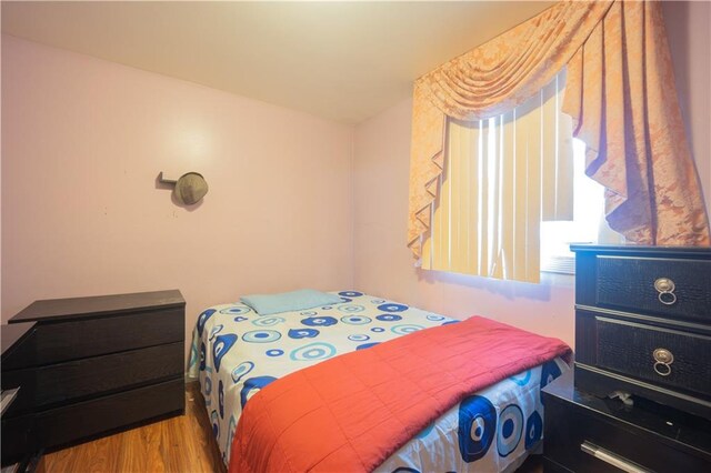 bedroom with light wood-type flooring