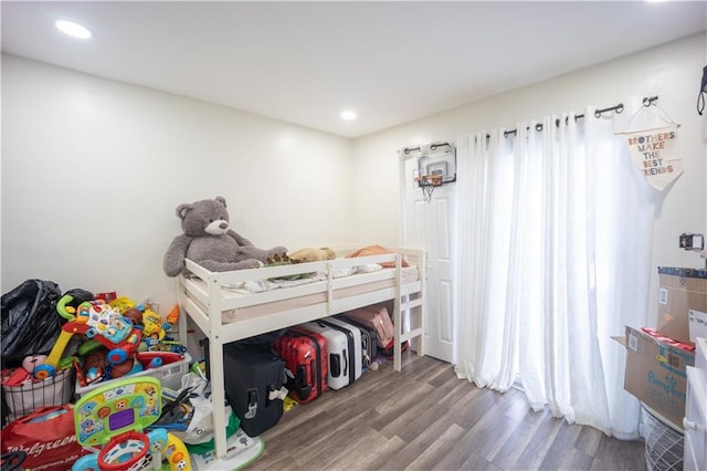 bedroom featuring recessed lighting and wood finished floors