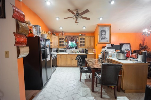 kitchen with lofted ceiling, sink, ceiling fan, decorative backsplash, and black appliances