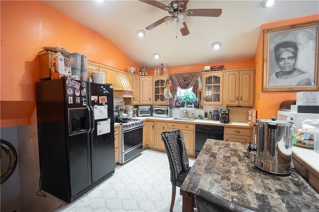 kitchen with a toaster, a sink, black appliances, vaulted ceiling, and glass insert cabinets