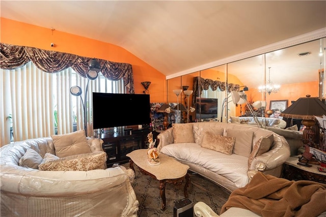 living room with vaulted ceiling and a notable chandelier