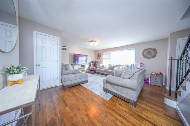 living room with dark hardwood / wood-style floors