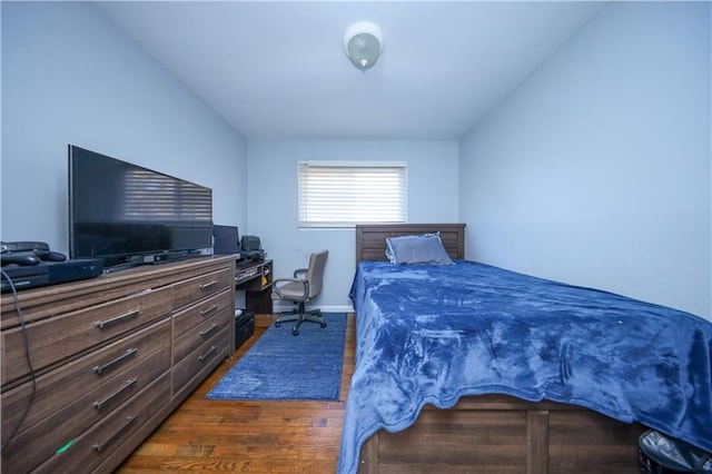 bedroom featuring dark hardwood / wood-style flooring