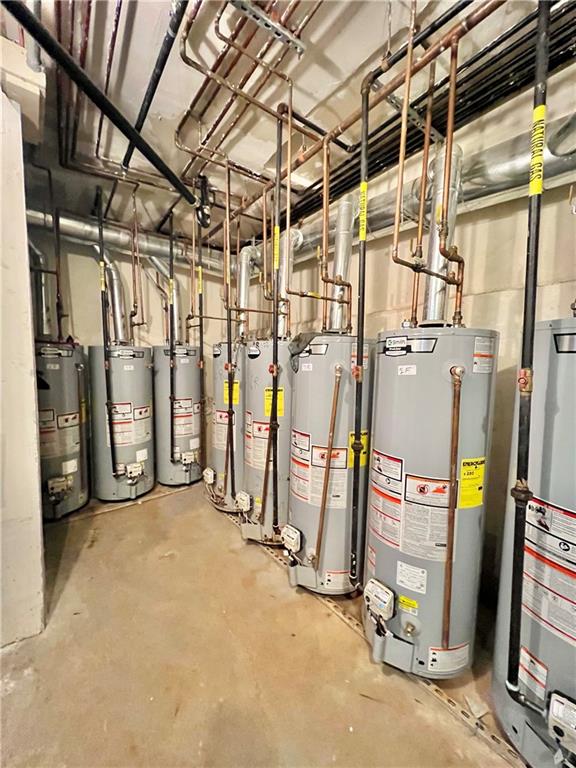 utility room featuring gas water heater