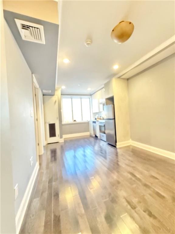 unfurnished living room featuring hardwood / wood-style floors