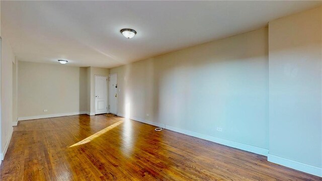 spare room featuring hardwood / wood-style flooring