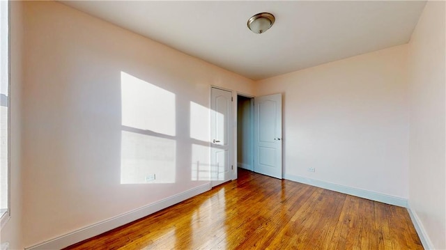 spare room featuring hardwood / wood-style floors