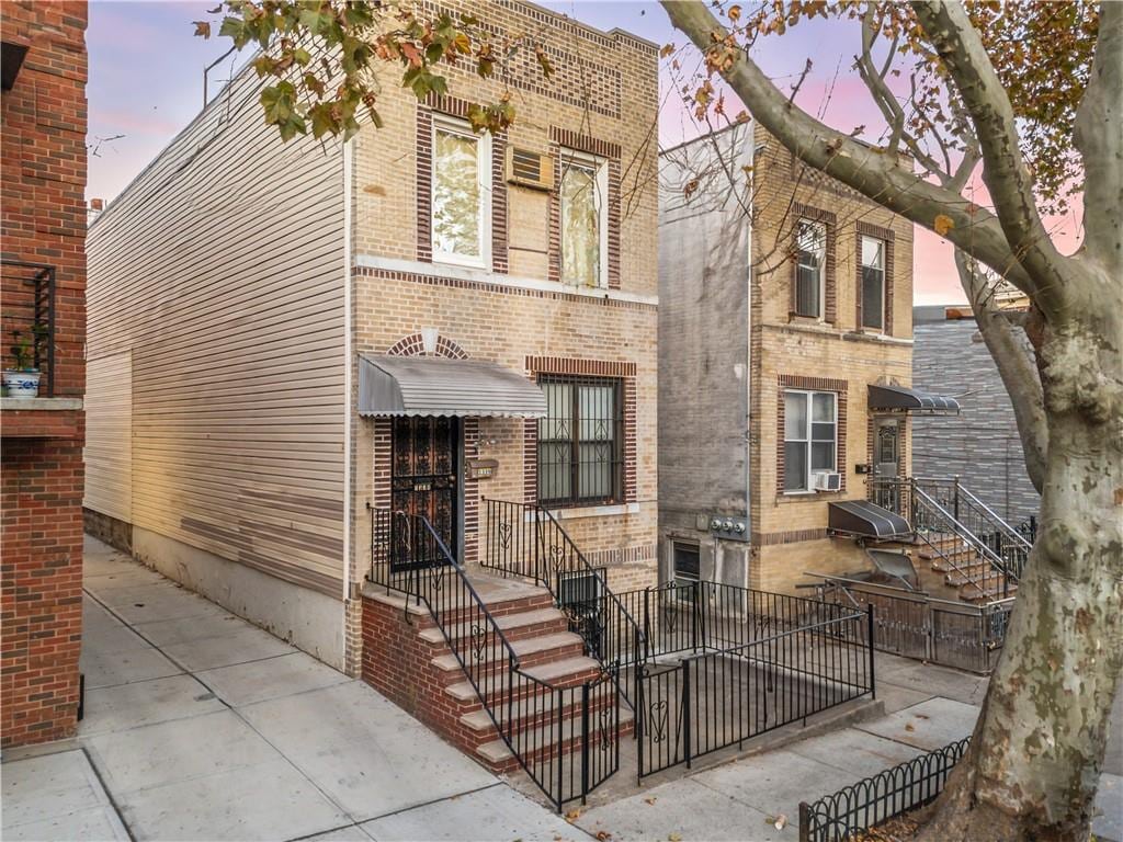 view of front of house with brick siding