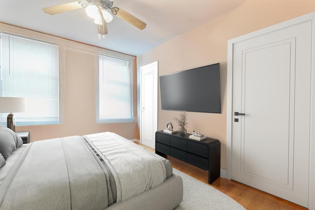 bedroom featuring ceiling fan and light hardwood / wood-style flooring