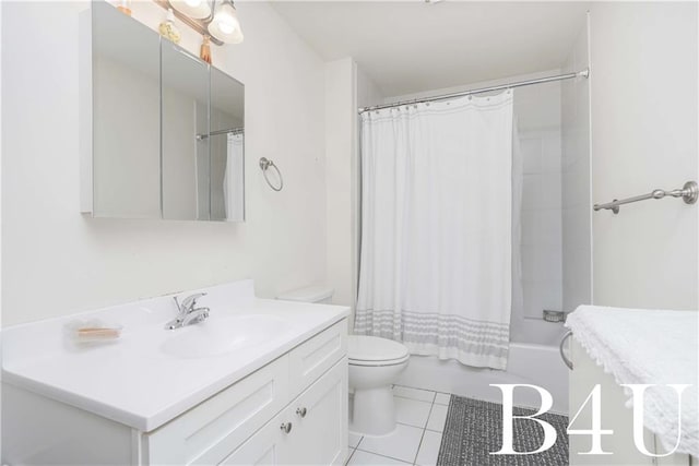 full bathroom featuring tile patterned flooring, vanity, toilet, and shower / tub combo