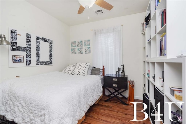 bedroom with ceiling fan and dark hardwood / wood-style flooring