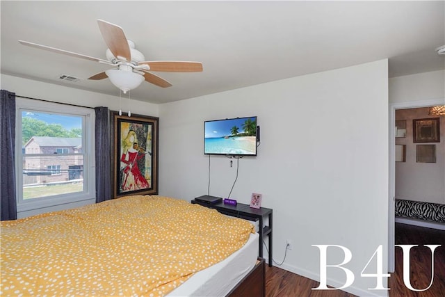 bedroom featuring ceiling fan and dark wood-type flooring