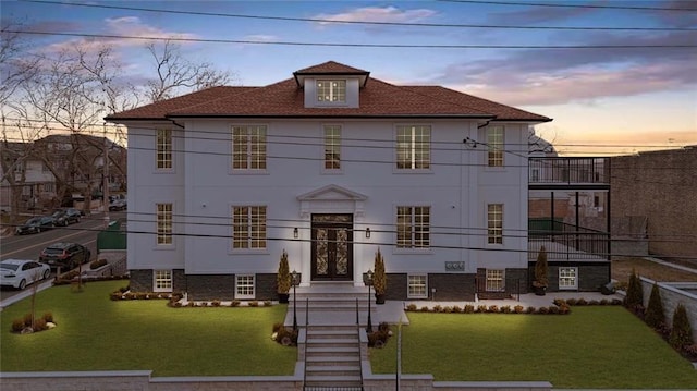 view of front of house with a lawn