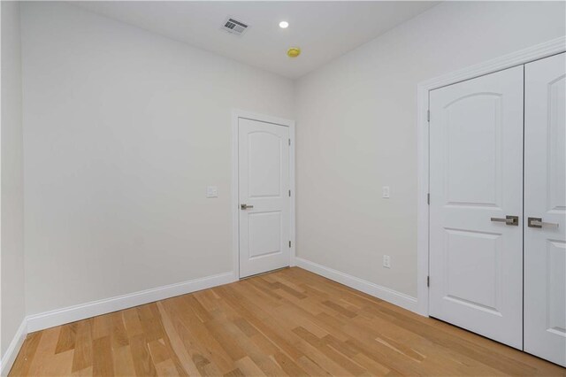 empty room featuring hardwood / wood-style floors