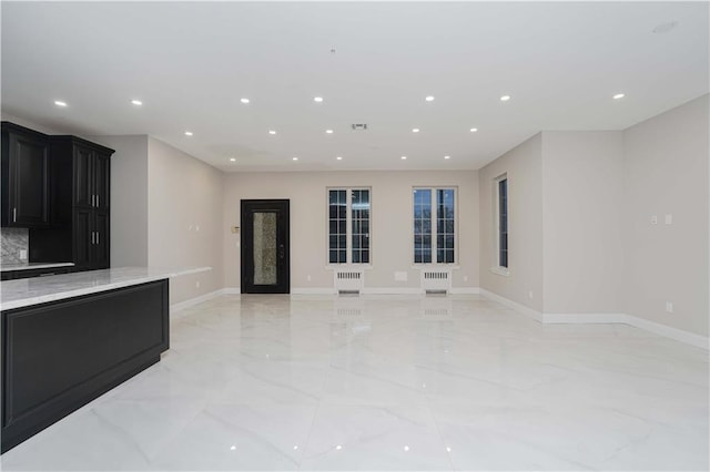 interior space with baseboards, marble finish floor, visible vents, and recessed lighting