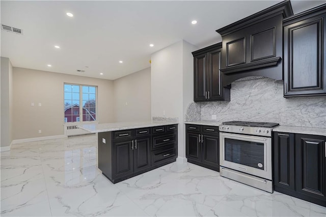 kitchen featuring marble finish floor, recessed lighting, visible vents, a peninsula, and stainless steel gas range oven