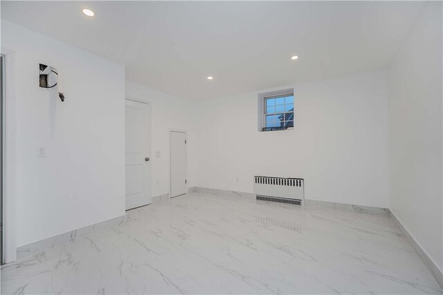 empty room featuring radiator heating unit