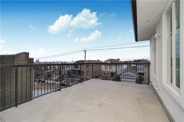 view of patio featuring a balcony