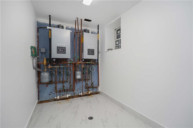 utility room featuring water heater