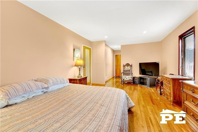 bedroom featuring recessed lighting and light wood-style flooring