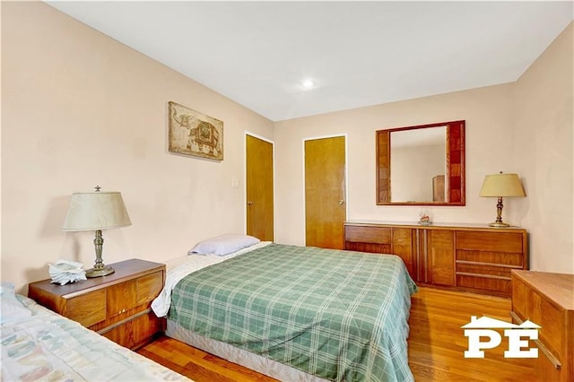 bedroom with wood finished floors