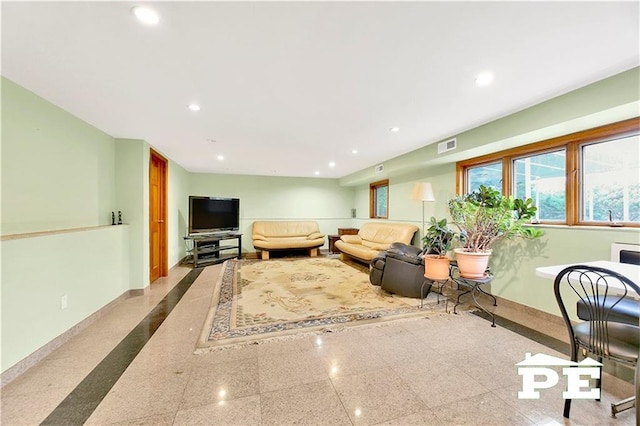 living room with visible vents, baseboards, and recessed lighting