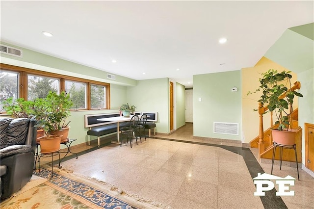 interior space with recessed lighting, visible vents, granite finish floor, and baseboards