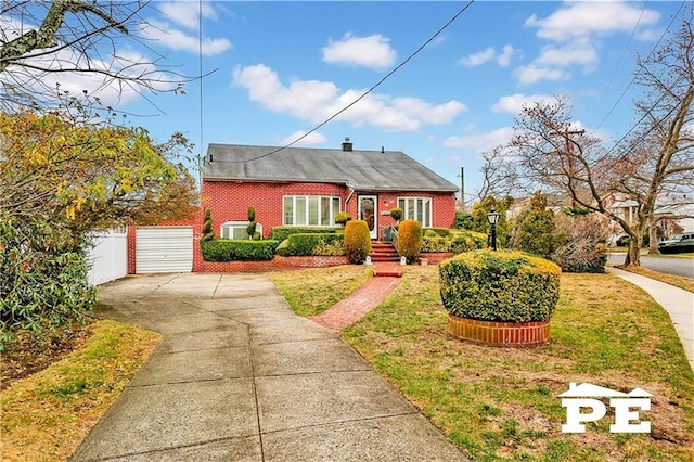 view of front of property with an attached garage, brick siding, fence, concrete driveway, and a front lawn