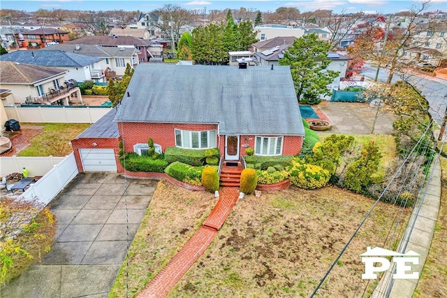 birds eye view of property with a residential view