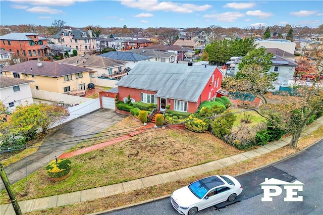 birds eye view of property with a residential view