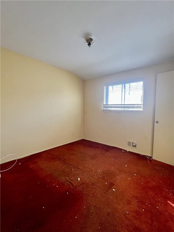 unfurnished room with carpet floors