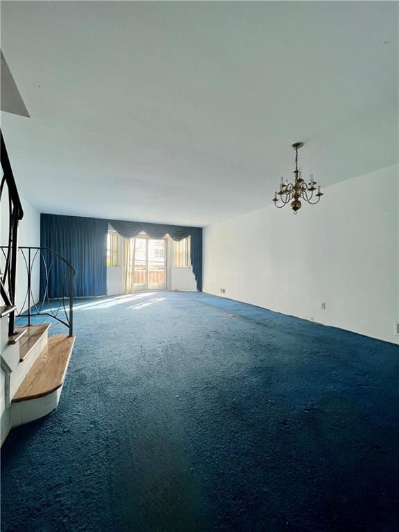 living area with carpet flooring and a chandelier