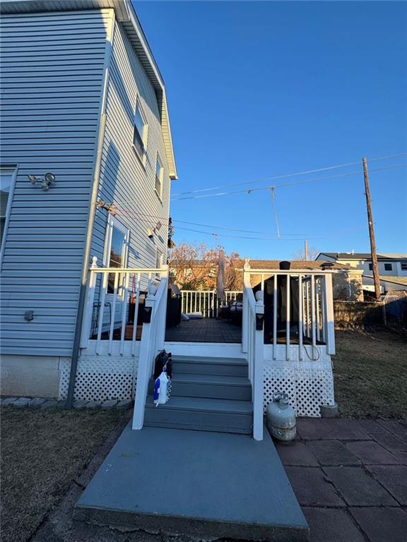 view of side of home featuring a deck