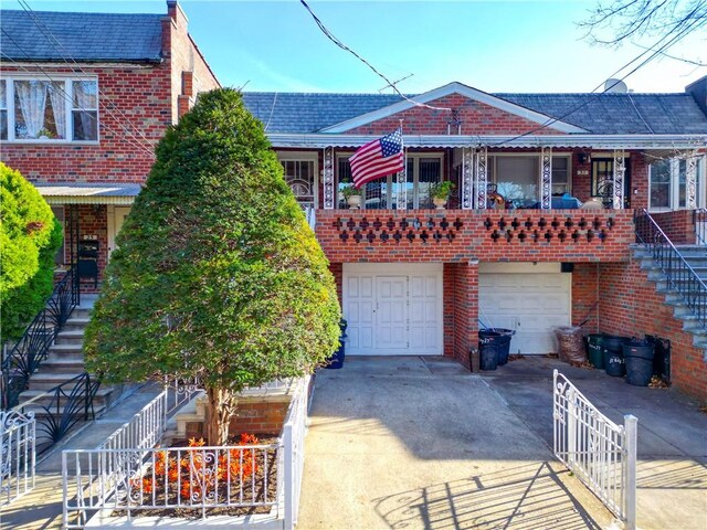 view of front of house featuring a balcony and a garage