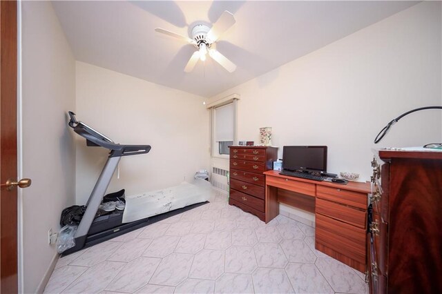 office area featuring ceiling fan and radiator