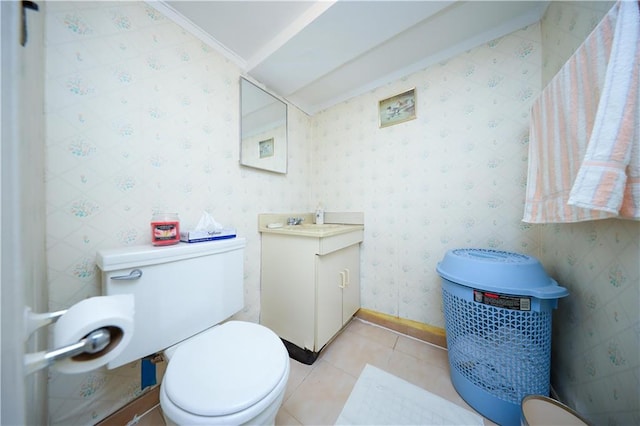 bathroom with tile patterned flooring, vanity, toilet, and ornamental molding